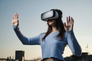 woman wearing a VR headset outdoors